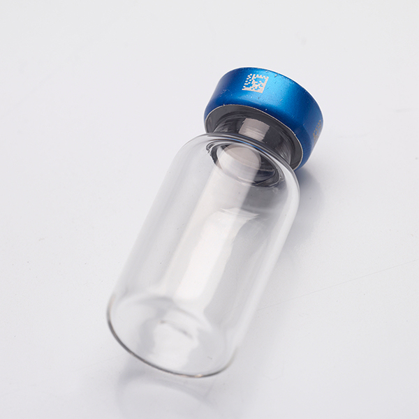 Clear glass vial with a blue cap, used for medical applications, showcasing durable laser marking for identification and traceability.