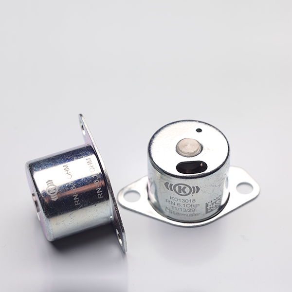 Metal automotive parts with laser markings, showcasing precise details and functional labels for asset identification.
