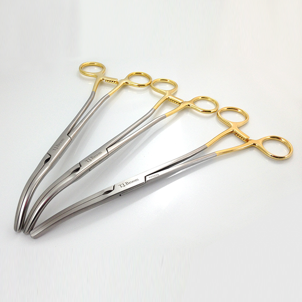 Medical scissors with gold handles and stainless steel bodies, showcasing precision and durability for surgical applications, relevant to Evright Industrial's laser marking services.